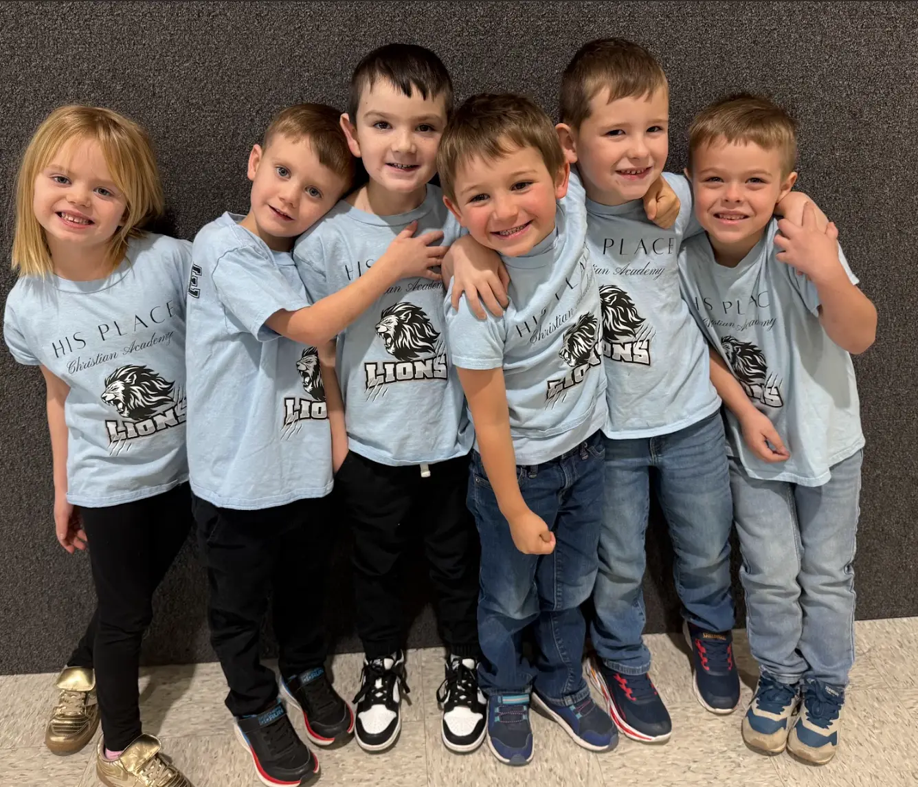 Young HPCA students in matching Lions shirts