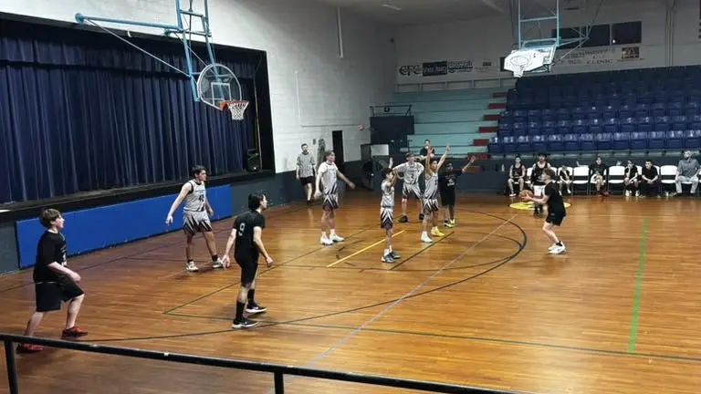 HPCA Lions basketball players at the free-throw line during a home game